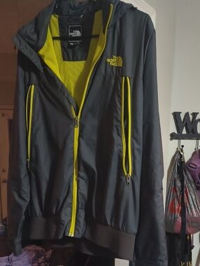 The North Face Black Jacket with Yellow Trim and Mesh Lining